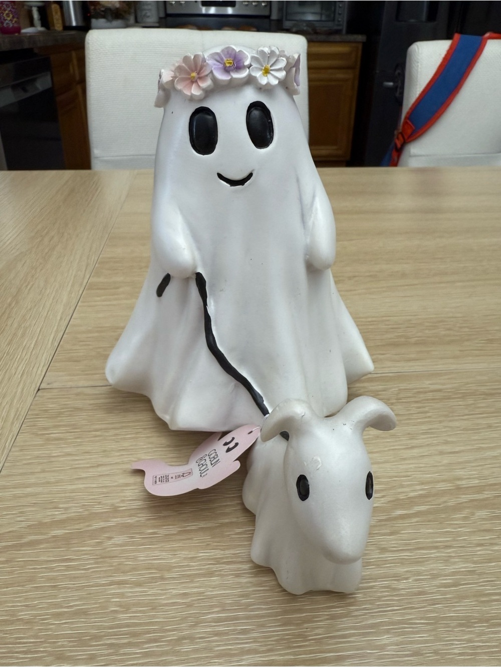 Flower girl ghost walking a dog